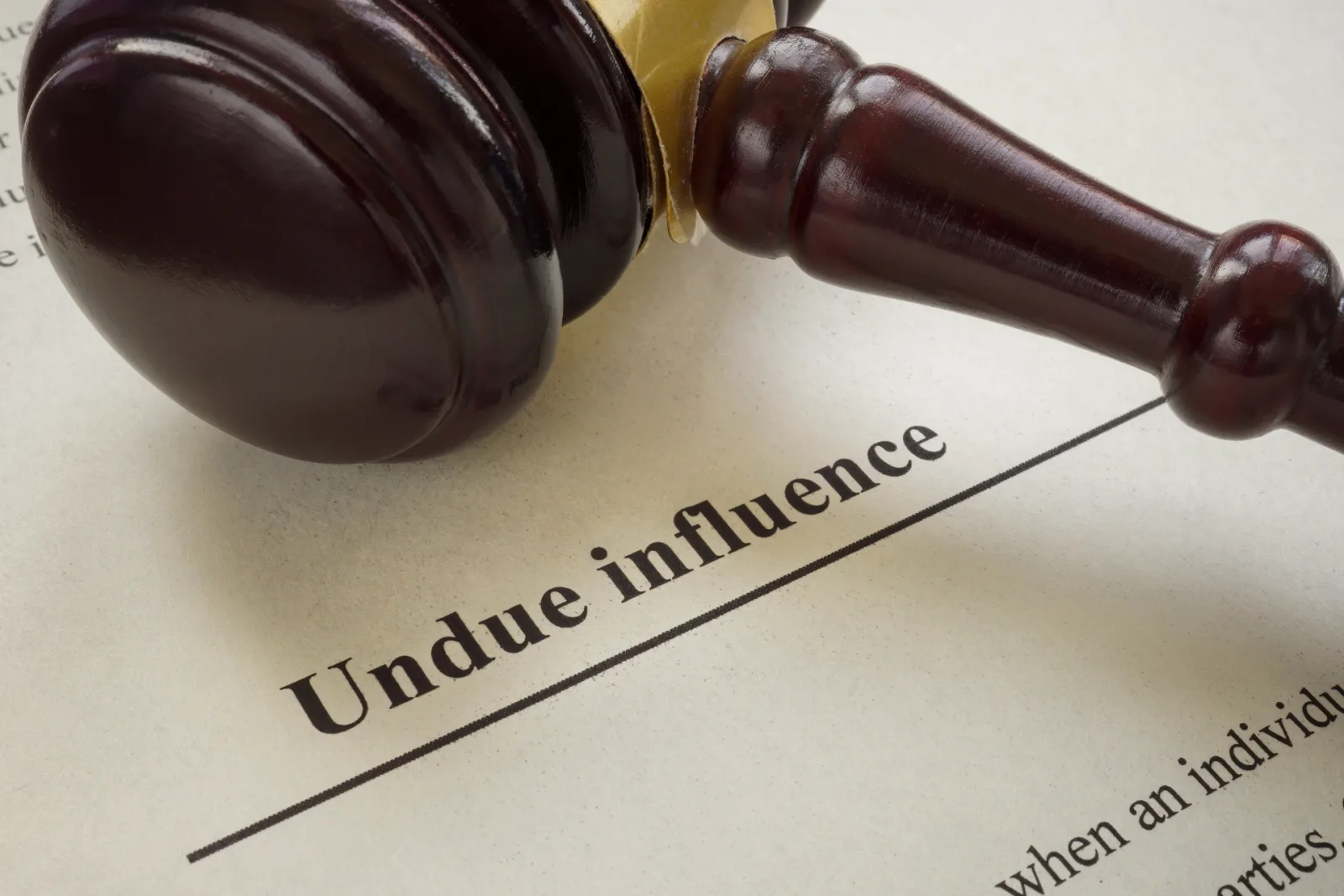Court gavel resting on legal documents referring to undue influence in a Victorian will dispute.