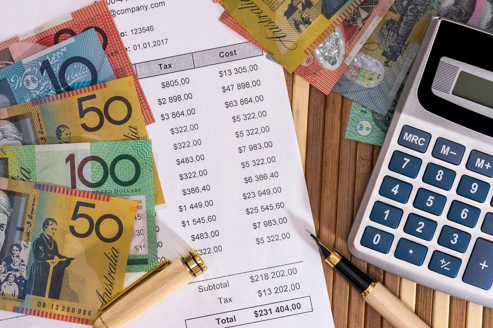 Commercial invoice, calculator and Australian banknotes illustrating business debt recovery.