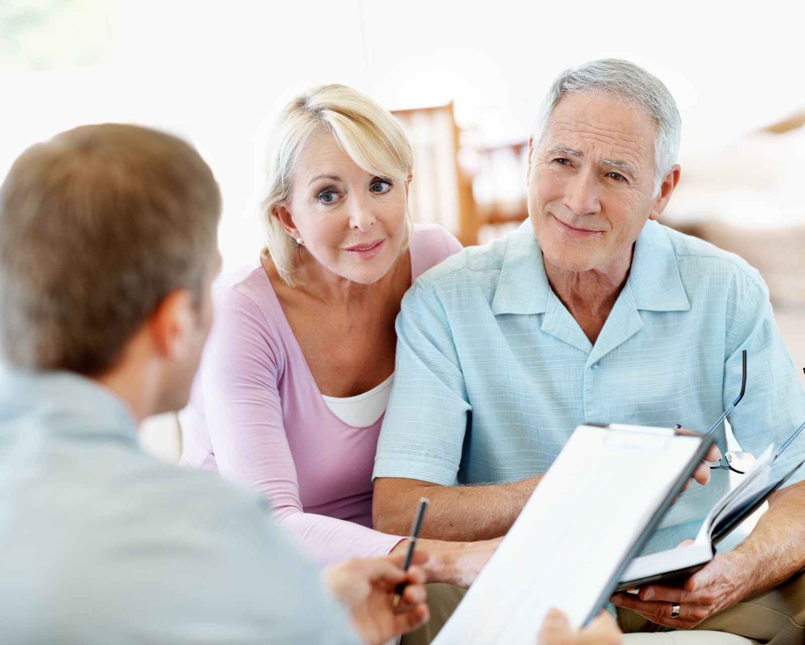 Older couple discussing superannuation and estate planning with an adviser