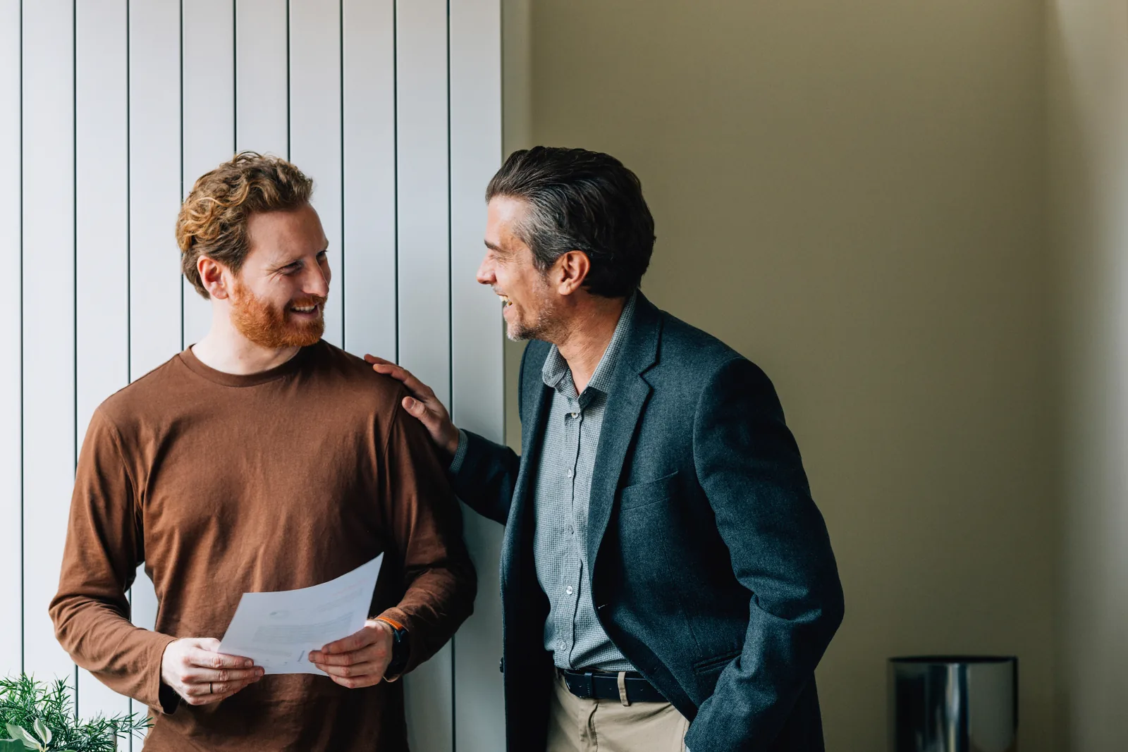 Two adult family members discussing documents together