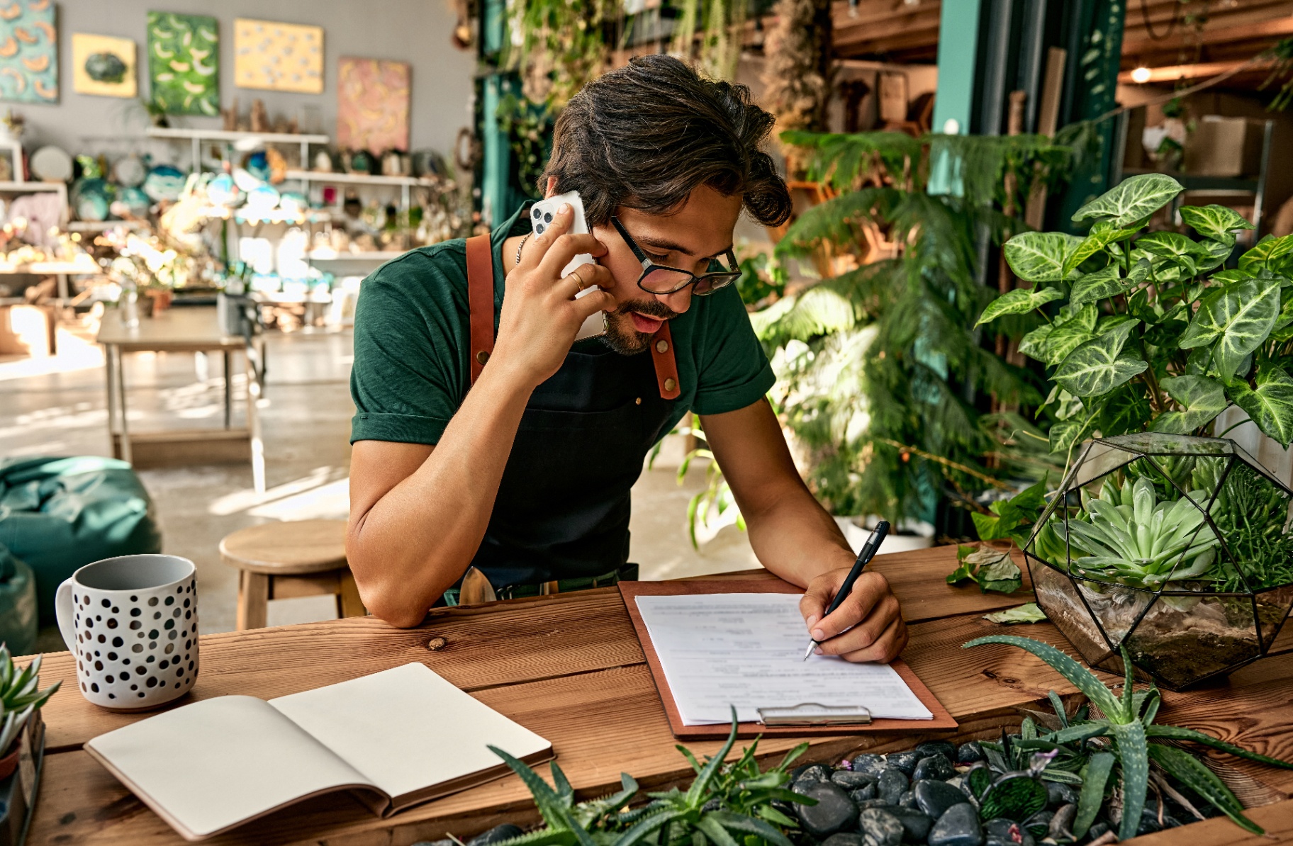 A retail business owner reviews documents in a shop — retail lease disputes in Victoria