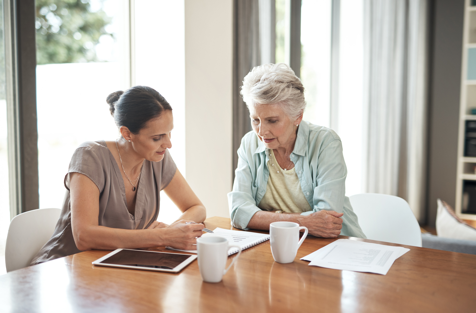 Family reviewing power of attorney documents before aged care placement