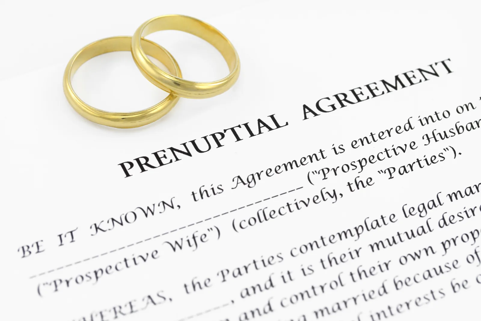 Prenuptial agreement document with wedding rings, illustrating a Binding Financial Agreement under Australian family law.