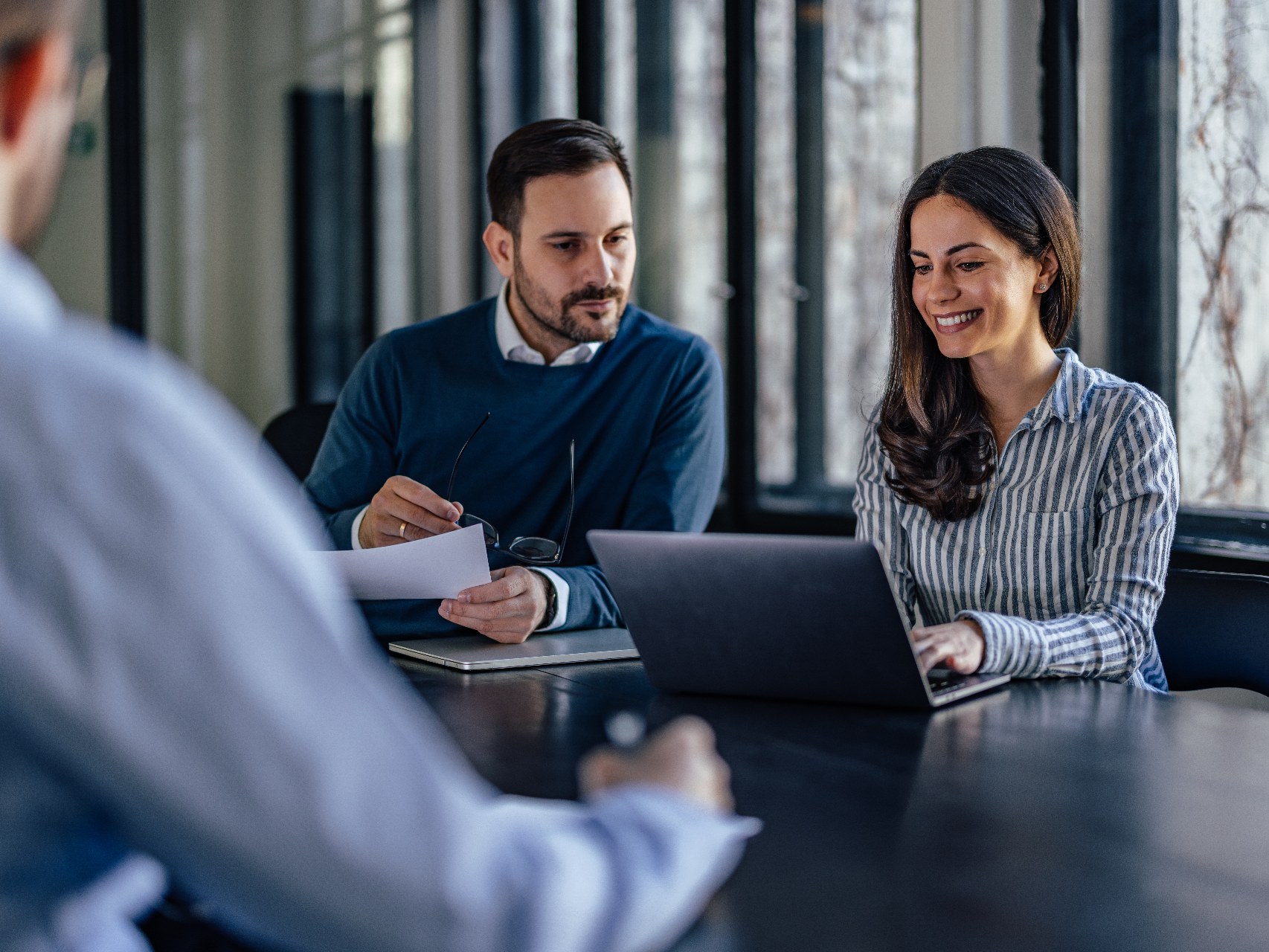 Advisers reviewing superannuation and SMSF succession documents with a client