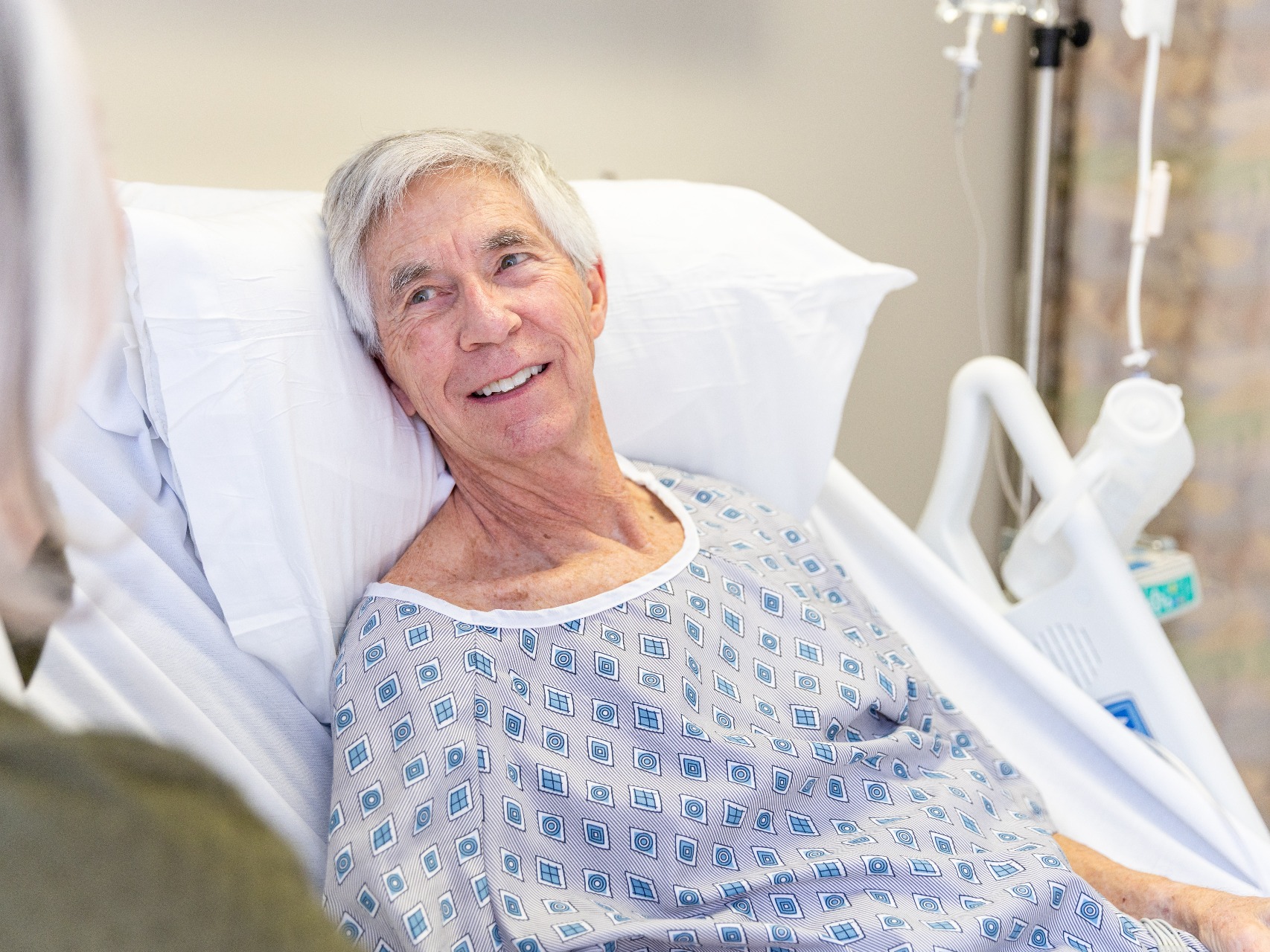 Older man in residential care speaking with an adviser during an elder law visit
