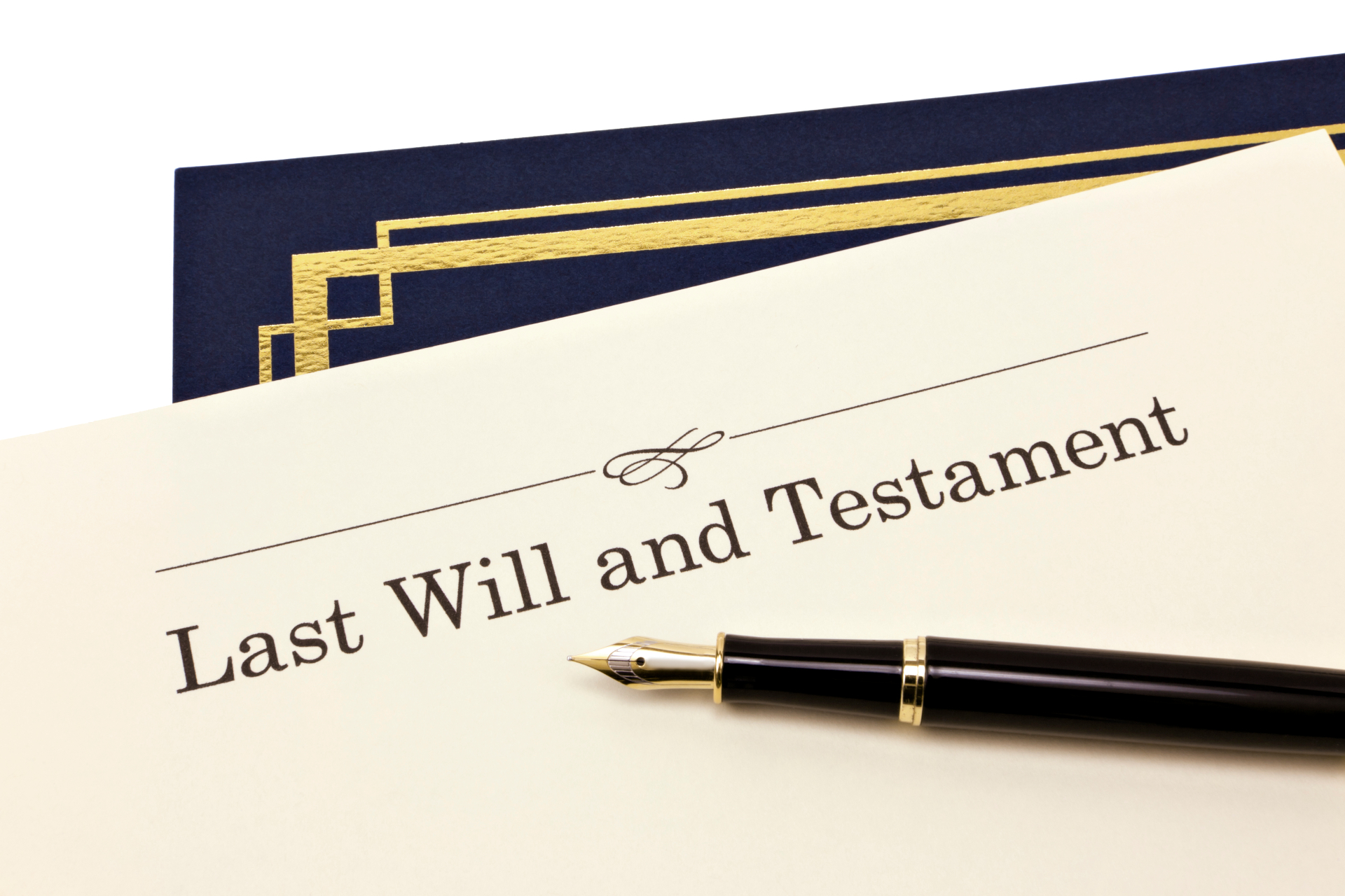 Last Will and Testament document with a fountain pen resting on a navy blue folder