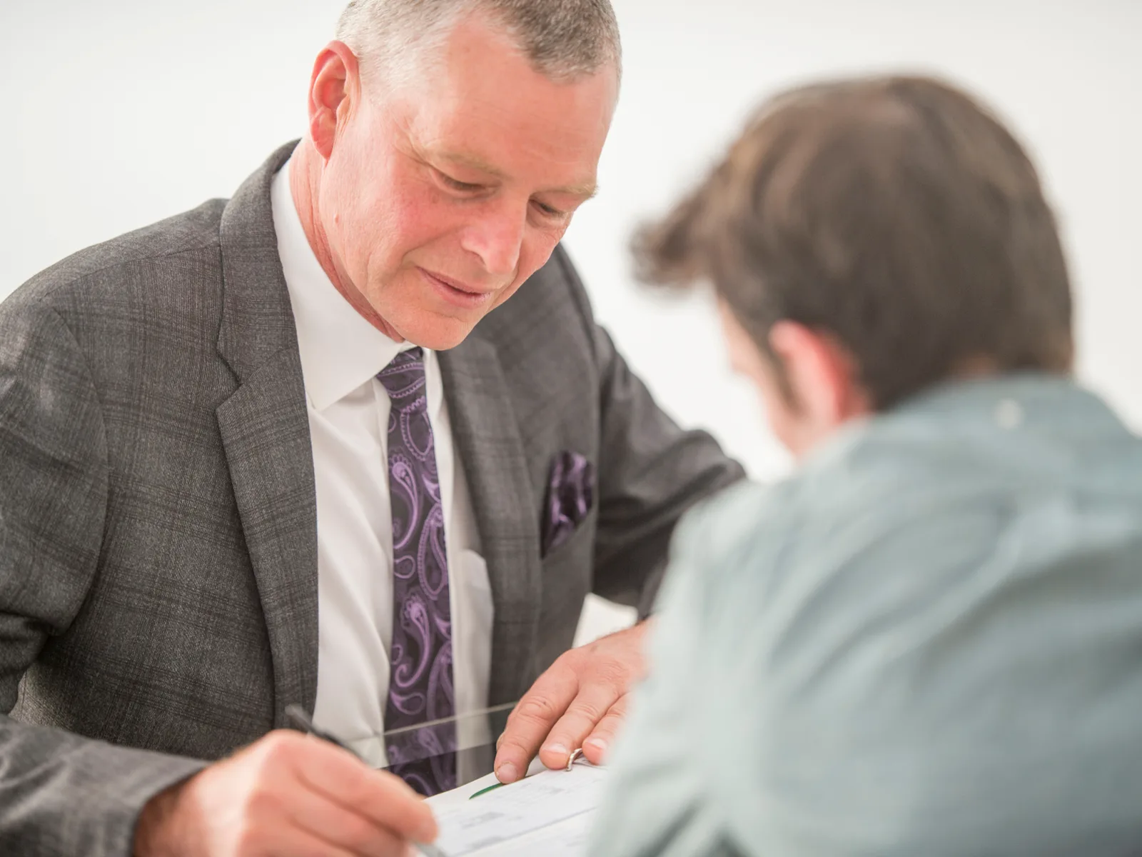 A Parke Lawyers lawyer preparing a client for an upcoming court appearance, reviewing documents together