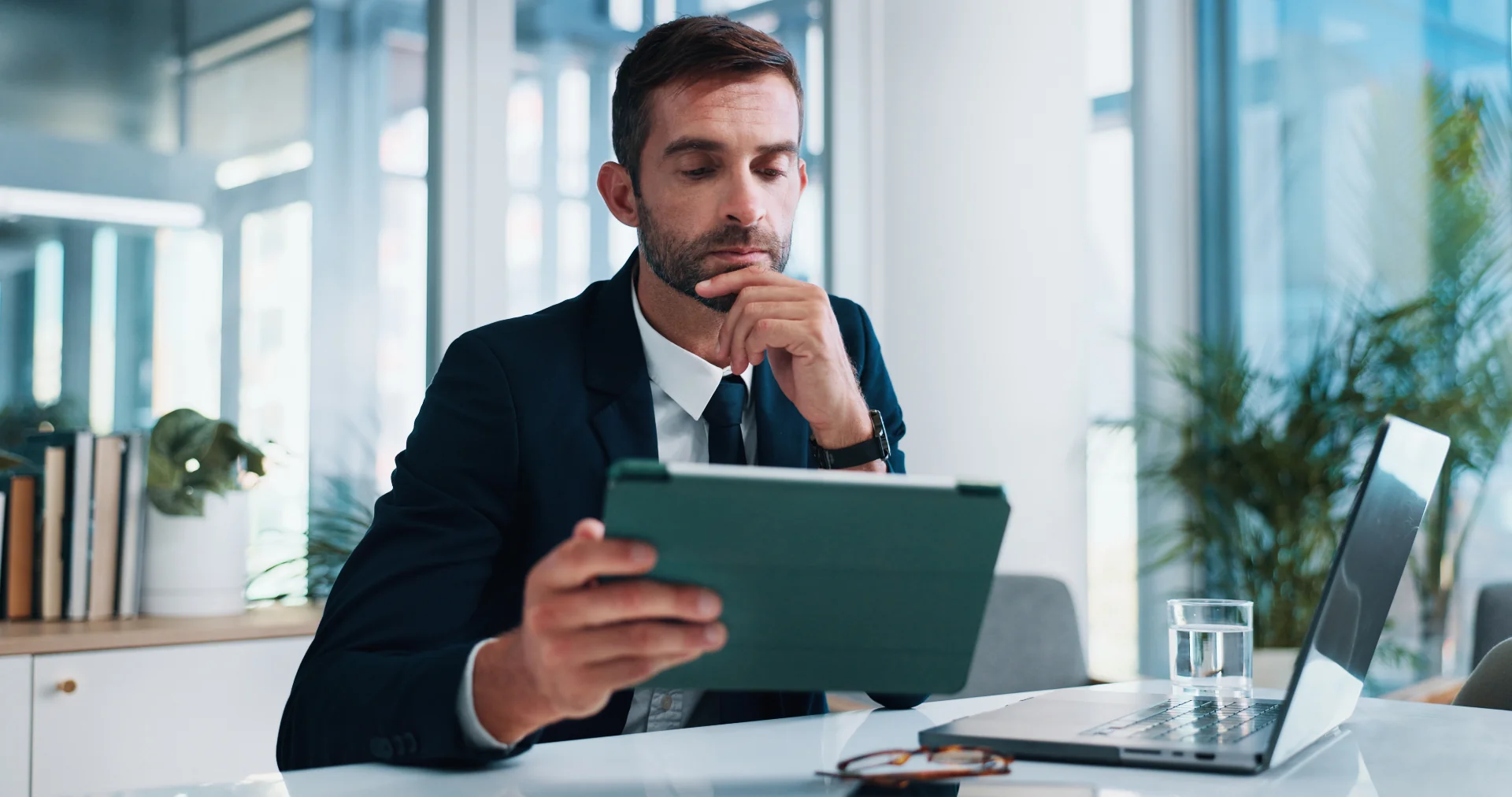Business executive reviewing workplace investigation materials and evidence during an employment-related inquiry.