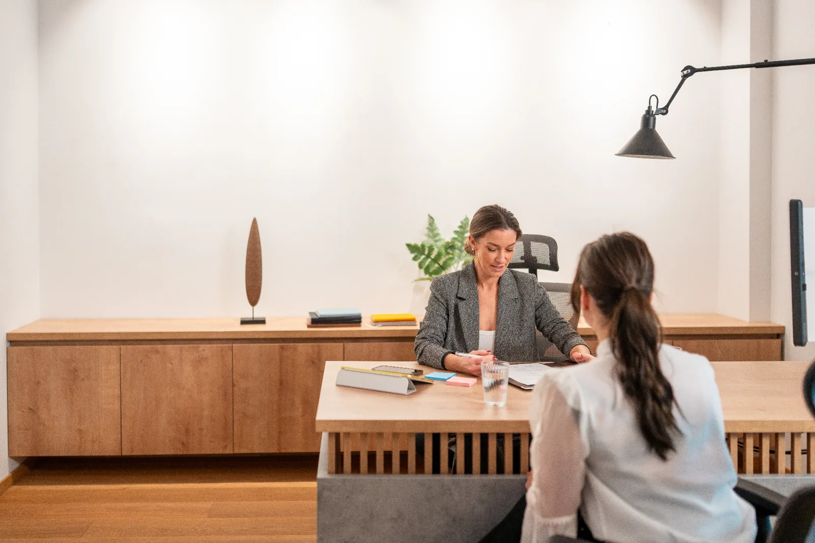 Parke Lawyers family lawyer in a calm, considered consultation with a client across a timber meeting table