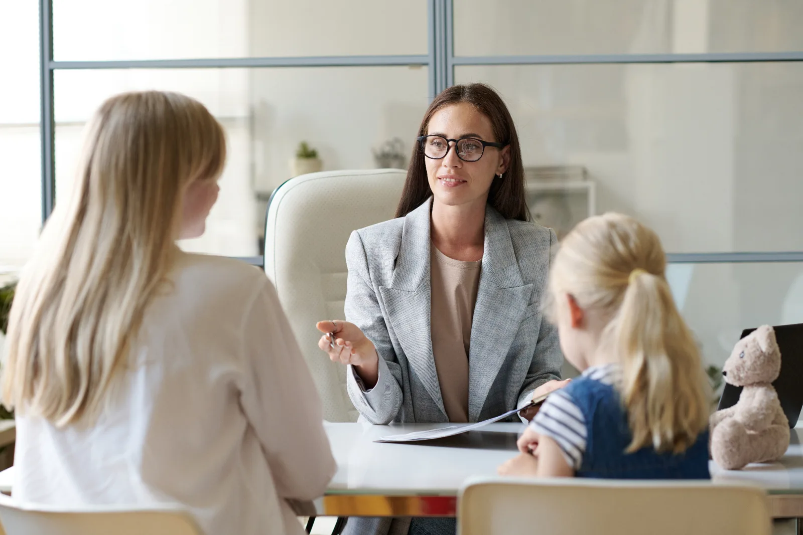 Family lawyer meeting privately with a separated parent and child in a Parke Lawyers consultation room